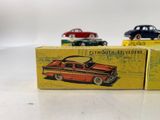two toy cars are sitting on a table next to each other