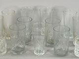 a lot of glasses that are sitting on a table