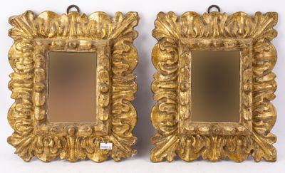pair of antique gold framed mirrors on a white background