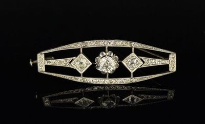 un bracelet-broche en diamant et or blanc