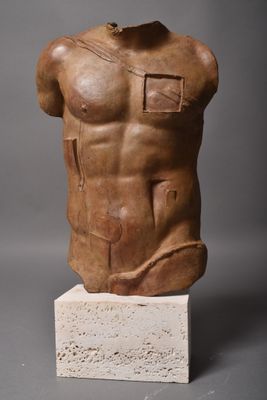 an image of a sculpture of a torso on a block