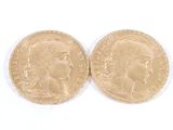 deux pièces d'or portant une tête de femme et une tête d'homme
