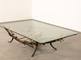 an image of a glass coffee table with antlers on it