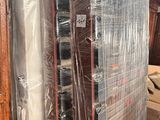 a lot of furniture that is wrapped up and ready to be shipped