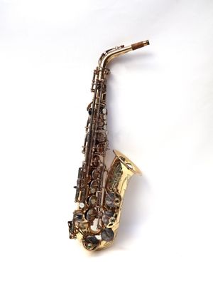 an image of a saxophone on a white surface with a white background