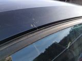 a car that has a lot of scratches on the roof