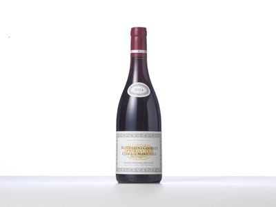a close up of a bottle of wine on a table