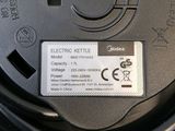 a close up of a black plastic container with a label on it
