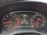 a close up of a car dashboard with a speedometer and gauges