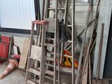 a room with a ladder and a lot of stuff on the floor