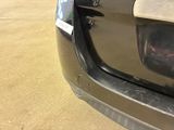 a close up of a car ' s bumper with a sticker on it