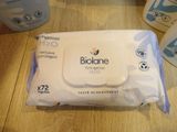 a bag of baby wipes sitting on a table next to a bottle of baby wipes