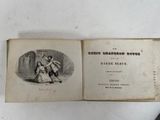 an old book with a picture of a man and a woman on it