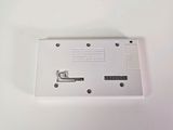 a white electronic device that is on a white surface