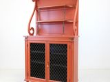 a red cabinet with a glass door and a shelf