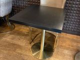 two chairs and a table in the corner of a room