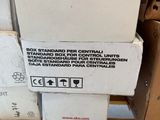 boxes stacked on top of each other on a shelf in a store