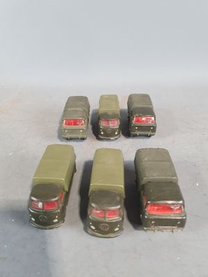 six toy cars that are lined up in a row