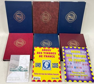 several books are sitting on a table with a white table cloth