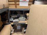a room with a lot of boxes and boxes on the shelves