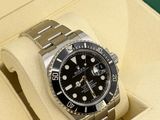 a rolex watch in a box on a table