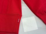 a close up of a pair of red sweatpants on a table