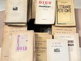 a lot of books that are stacked on top of each other