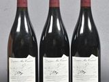 three bottles of wine sitting on top of a table next to each other