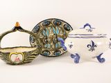 three different types of teapots and saucers on a white surface