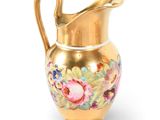 an image of a gold vase with flowers on it on a white background
