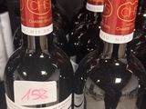several bottles of wine are lined up on a table