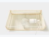 a white tray with a bottle of water on top of it