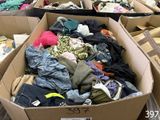 many boxes of clothes that are sitting on the floor