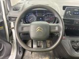 dashboard of a car with a steering wheel and dashboard controls