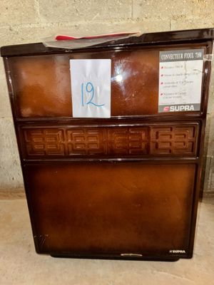 a brown chest of drawers with a price tag on it