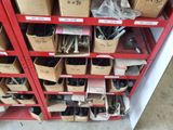 many boxes of assorted tools on a shelf