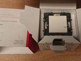 a box that has a small electronic device inside of it