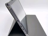 a laptop that is sitting on top of a stand