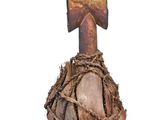 a wooden object with a knot around it on a white background
