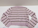 pink and brown striped sweater on a white table with a tag