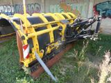a yellow and black machine that is sitting in the grass