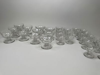 a lot of glasses that are sitting on a table