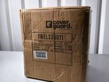 the box is sitting on the table in front of the wall