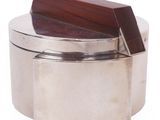 a silver box with a wooden lid on a white background