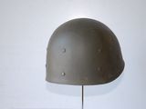 a helmet that is on a stand on a table