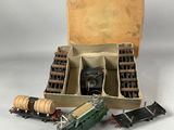 a box with a train engine and other toy trains