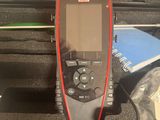 an image of a portable device sitting in a case on a table