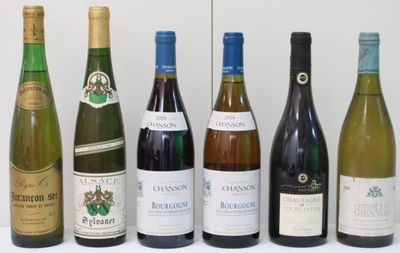 bottles of wine are lined up in a row on a table