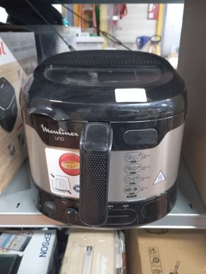 an image of a black and silver air fryer sitting on top of a shelf