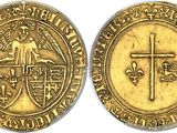 a gold coin with a cross on the front and a cross on the back